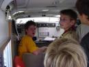 A very tired KU0DM (yellow shirt) demonstrates calling CQ during JOTA 2007
inside of the county's SATERN trailer.
